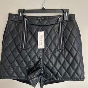 Quilted vegan leathered shorts with zippers and pockets. 
Size L